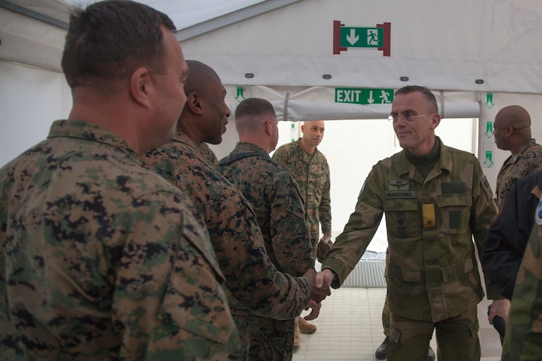 Norwegian Army Brig. Gen. Jon Morten Mangersnes, right, the commander of the Norwegian Land Warfare Center, shakes the hands of Marines with 2nd Marine Logistics Group-Forward (2nd MLG-Fwd), in Stjødal, Norway, Nov. 5, 2018. Leaders of the Norwegian military met with leaders and noncommissioned officers (NCOs) of 2nd MLG-Fwd to discuss the role of the Marine Corps NCO during Exercise Trident Juncture 18. The exercise enhances the U.S. and NATO Allies’ and partners’ abilities to work together collectively to conduct military operations under challenging conditions. (U.S. Marine Corps photo by Lance Cpl. Scott R. Jenkins)