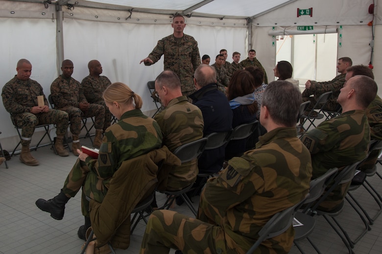 U.S. Marine Corps 1st Sgt. Johnny Huff, with 2nd Marine Logistics Group-Forward 2nd (MLG-Fwd), speaks to Norwegian military leaders in Stjødal, Norway, Nov. 5, 2018. Leaders of the Norwegian military met with leaders and noncommissioned officers (NCOs) of 2nd MLG-Fwd to discuss the role of the Marine Corps NCO during Exercise Trident Juncture 18. The exercise enhances the U.S. and NATO Allies’ and partners’ abilities to work together collectively to conduct military operations under challenging conditions. (U.S. Marine Corps photo by Lance Cpl. Scott R. Jenkins)