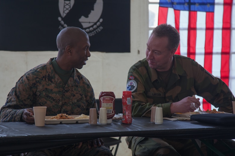 U.S. Marine Corps 1st Sgt. Nicholas Underwood, the acting sergeant major of Combat Logistics Battalion 251, 2nd Marine Logistics Group-Forward (2nd MLG-Fwd), speaks with Lt. Col. Ruwk Larsen, with the Norwegian Army Land Warfare Center, in Stjødal, Norway, Nov. 5, 2018. Leaders of the Norwegian military met with leaders and noncommissioned officers (NCOs) of 2nd MLG-Fwd to discuss the role of the Marine Corps NCO during Exercise Trident Juncture 18. The exercise enhances the U.S. and NATO Allies’ and partners’ abilities to work together collectively to conduct military operations under challenging conditions. (U.S. Marine Corps photo by Lance Cpl. Scott R. Jenkins)