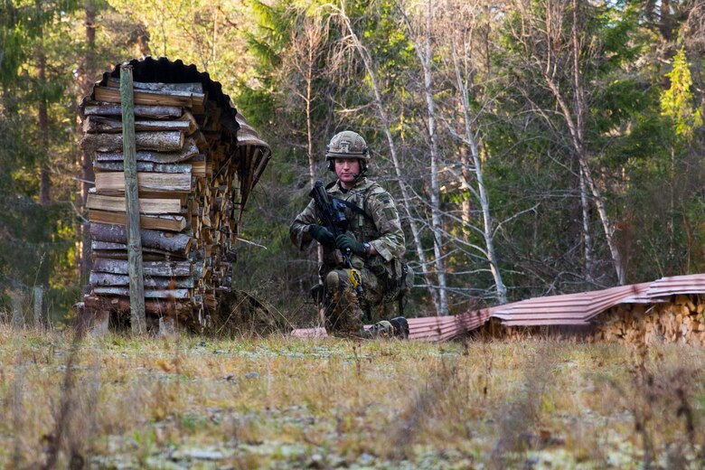 A British Royal Marine provides security while searching for a simulated isolated service member during a Tactical Recovery of Aircraft and Personnel (TRAP) exercise in Rindal, Norway, Nov. 6, 2018. The Royal Marines with X-Ray Company, 45 Commando, worked in conjunction with the 24th Marine Expeditionary Unit and assets from Marine Aircraft Group 29 to exercise their TRAP proficiency and bilateral interoperability during Exercise Trident Juncture 18. The exercise enhances the U.S. and NATO Allies’ and partners’ abilities to work together collectively to conduct military operations under challenging conditions. (U.S. Marine Corps photo by Cpl. Margaret Gale)