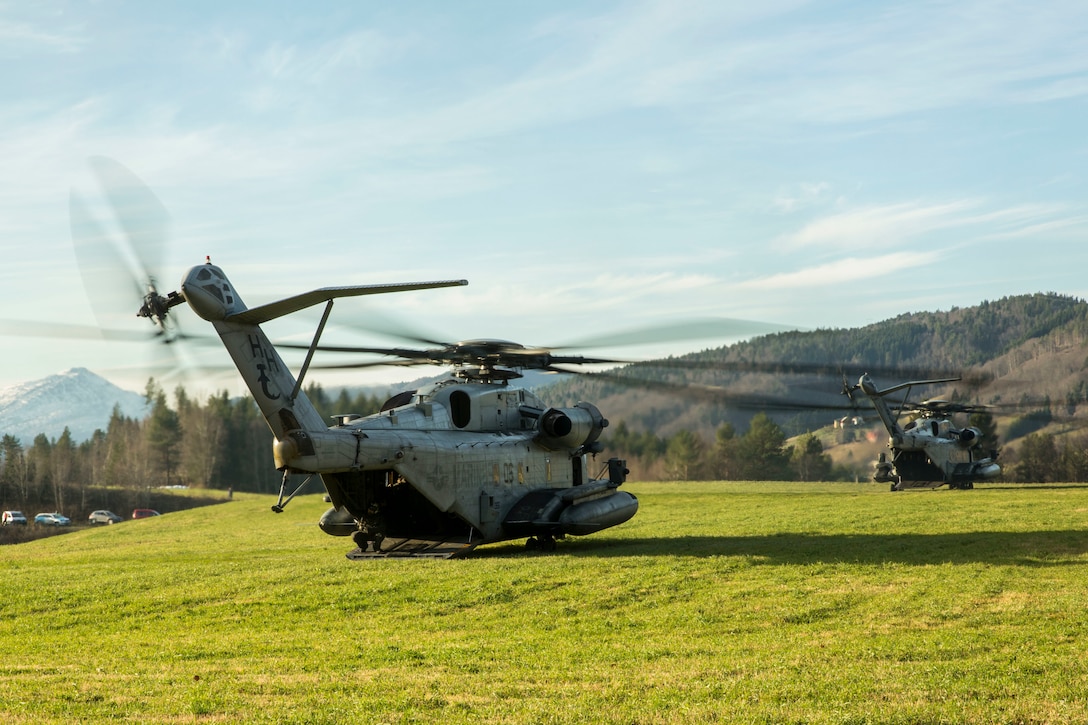 Two U.S. Marine Corps CH-53E Super Stallions land during a Tactical Recovery of Aircraft and Personnel (TRAP) exercise in Rindal, Norway, Nov. 6, 2018. British Royal Marines with X-Ray Company, 45 Commando, worked in conjunction with the 24th Marine Expeditionary Unit and assets from Marine Aircraft Group 29 to increase their TRAP proficiency and bilateral interoperability during Exercise Trident Juncture 18. The exercise enhances the U.S. and NATO Allies’ and partners’ abilities to work together collectively to conduct military operations under challenging conditions. The aircraft is with Marine Light Attack Helicopter Squadron 269. (U.S. Marine Corps photo by Cpl. Margaret Gale)