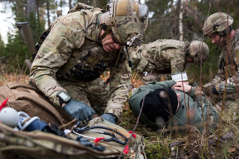 British Royal Marines prepare to evacuate Capt. Josef Otmar during a Tactical Recovery of Aircraft and Personnel (TRAP) exercise in Rindal, Norway, Nov. 6, 2018. The Royal Marines with X-Ray Company, 45 Commando, worked in conjunction with the 24th Marine Expeditionary Unit and assets from Marine Aircraft Group 29 to exercise their TRAP proficiency and bilateral interoperability during Exercise Trident Juncture 18. Otmar is a pilot with Marine Heavy Helicopter Squadron 366 and was playing the role of an isolated and injured service member. The exercise enhances the U.S. and NATO Allies’ and partners’ abilities to work together collectively to conduct military operations under challenging conditions. (U.S. Marine Corps photo by Cpl. Margaret Gale)