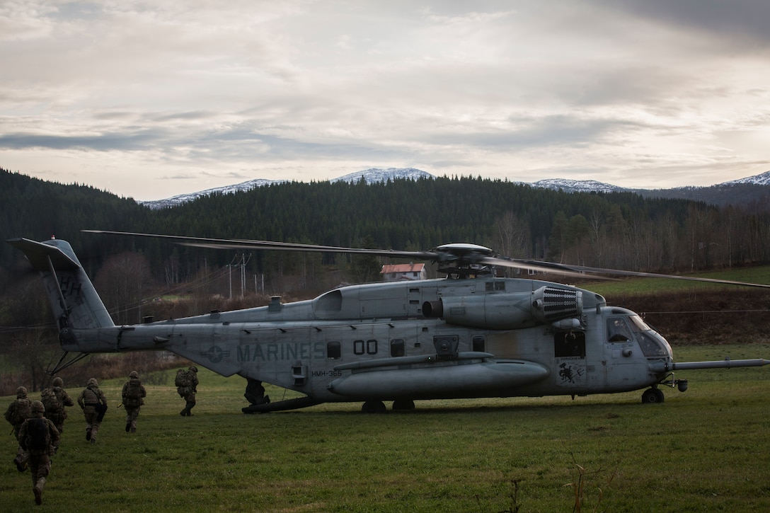 A U.S. Marine Corps CH-53E Super Stallion lifts off from Rindal, Norway, during a Tactical Recovery of Aircraft and Personnel (TRAP) exercise, Nov. 6, 2018. The Royal Marines with X-Ray Company, 45 Commando, worked in conjunction with the 24th Marine Expeditionary Unit and assets from Marine Aircraft Group 29 to exercise their TRAP proficiency and bilateral interoperability during Exercise Trident Juncture 18. The exercise enhances the U.S. and NATO Allies’ and partners’ abilities to work together collectively to conduct military operations under challenging conditions. The aircraft is with Marine Heavy Helicopter Squadron 366, MAG-29. (U.S. Marine Corps photo by Cpl. Margaret Gale)