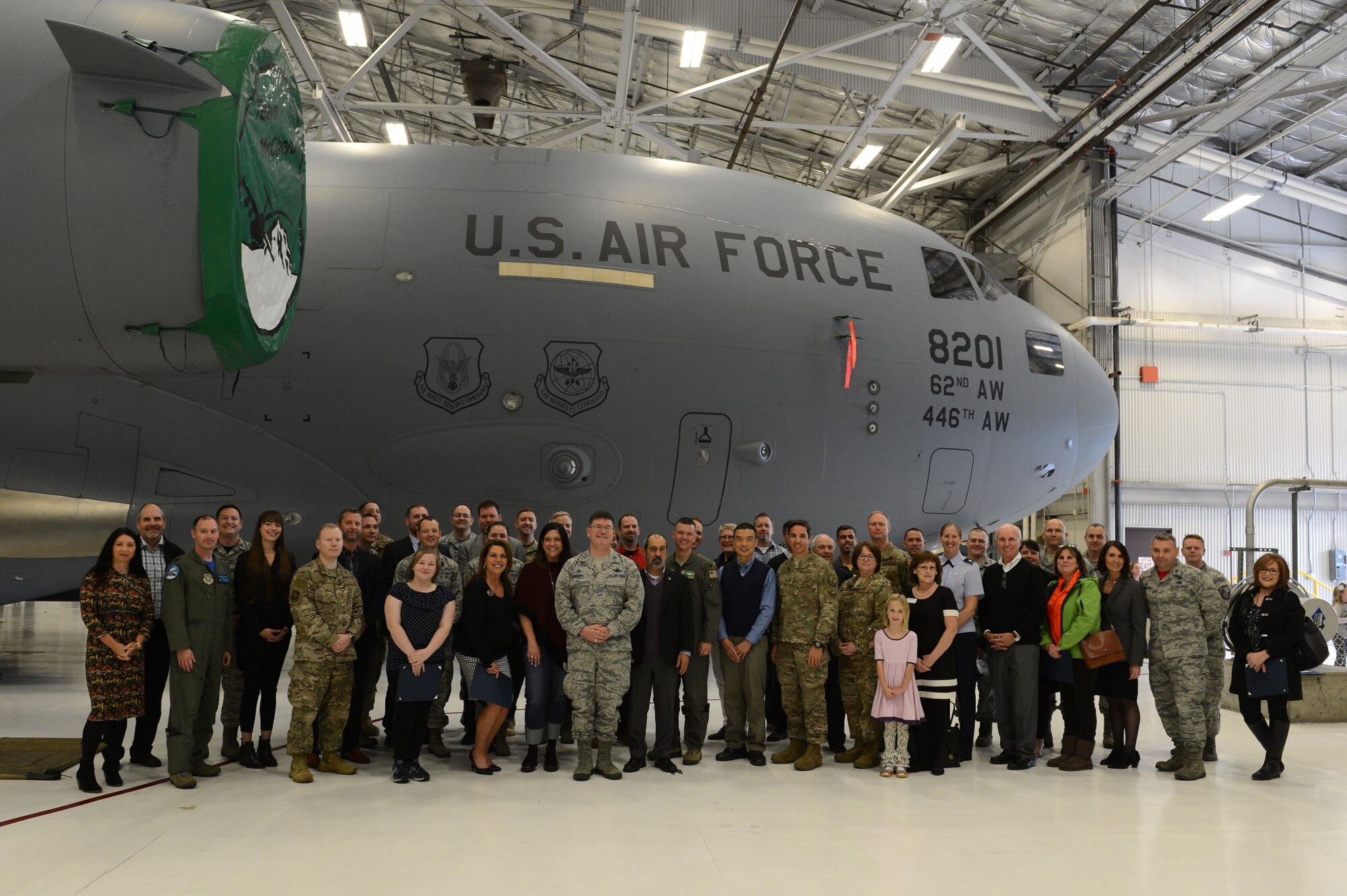 Newly inducted honorary commanders, alumni, unit commanders and family members attend the Team McChord Honorary Commander induction ceremony, Nov. 2, 2018, at Joint Base Lewis-McChord, Wash. Honorary commanders serve for two years before becoming alumni. (U.S. Air Force photo by A1C Sara Hoerichs)