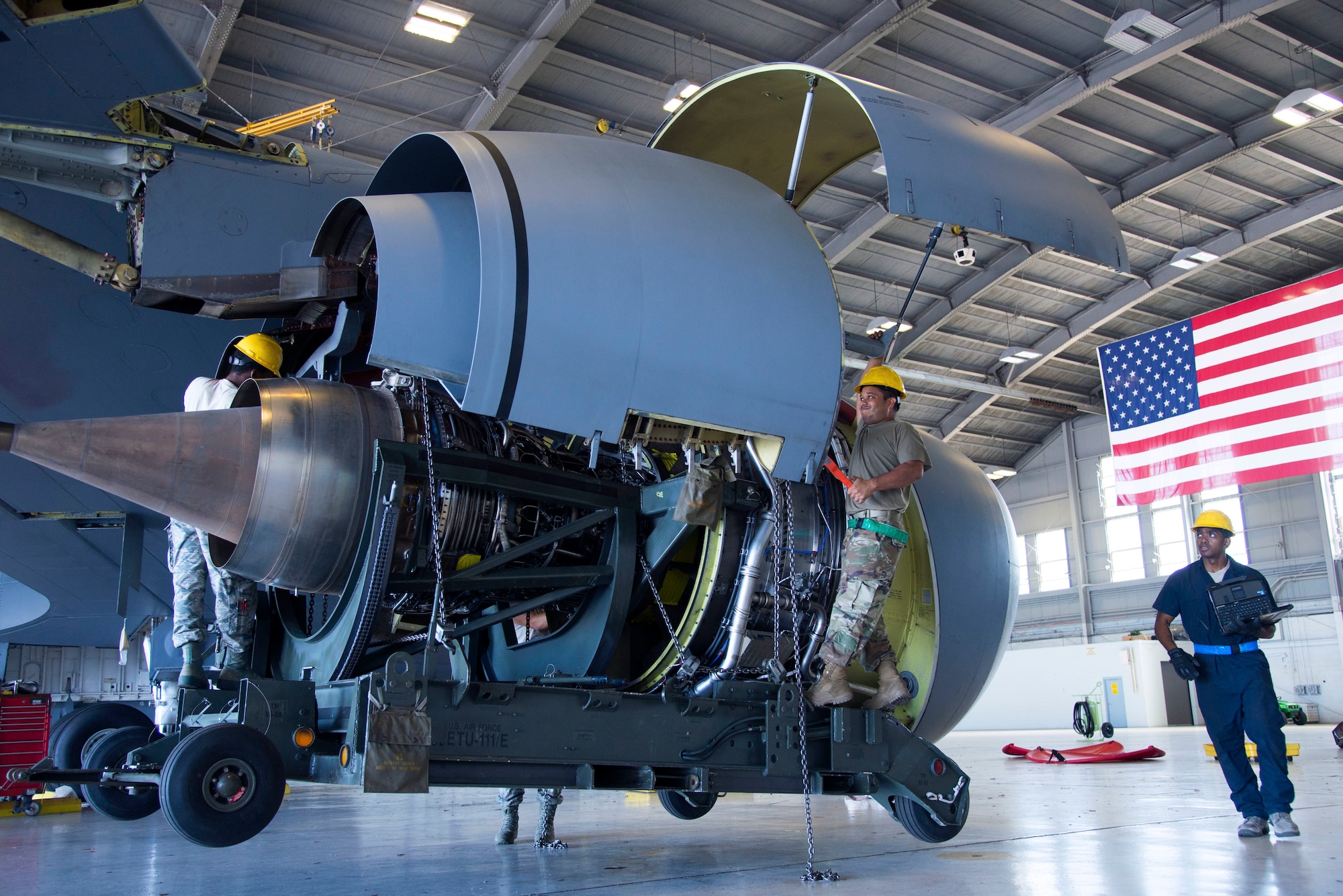 U.S. Air Force 6th Aircraft Maintenance Squadron aerospace propulsion Airmen, hoist a KC-135 Stratotanker engine at MacDill Air Force Base, Fla., Nov. 8, 2018.