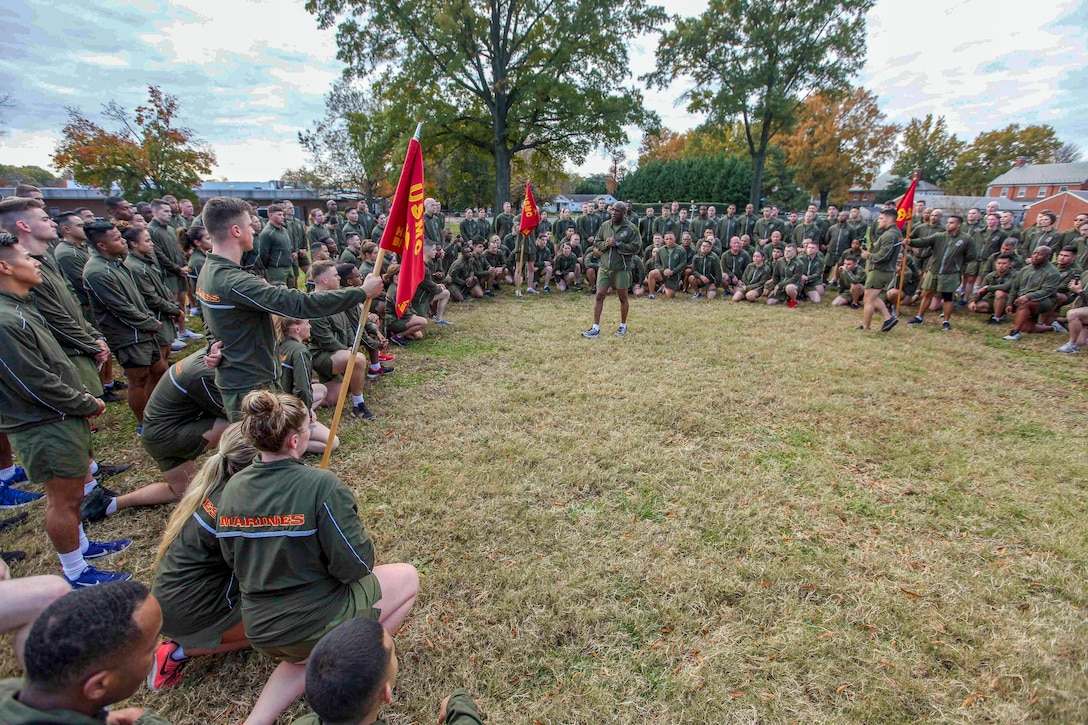 A sergeant major speaks to a large group of Marines.