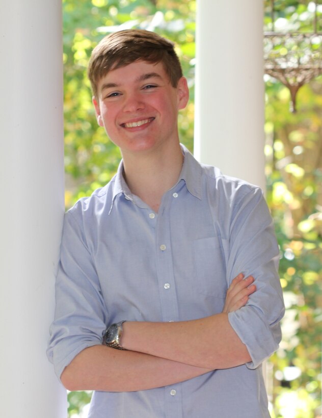 Mason Lees standing by pillar