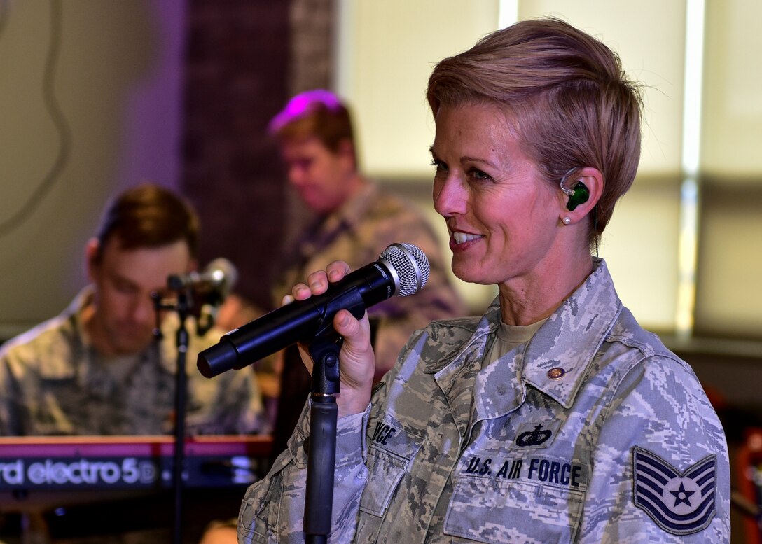 Retired U.S. Air Force Tech. Sgt.  Krista Joyce, vocalist for Blue Steel, sings at Santo Domingo Elementary-Middle School, Kewa Pueblo, Oct. 24, 2018. Blue Steel is a Top 40 band, meaning that they cover chart hit songs. (U.S. Air Force photo by Airman 1st Class Austin J. Prisbrey)