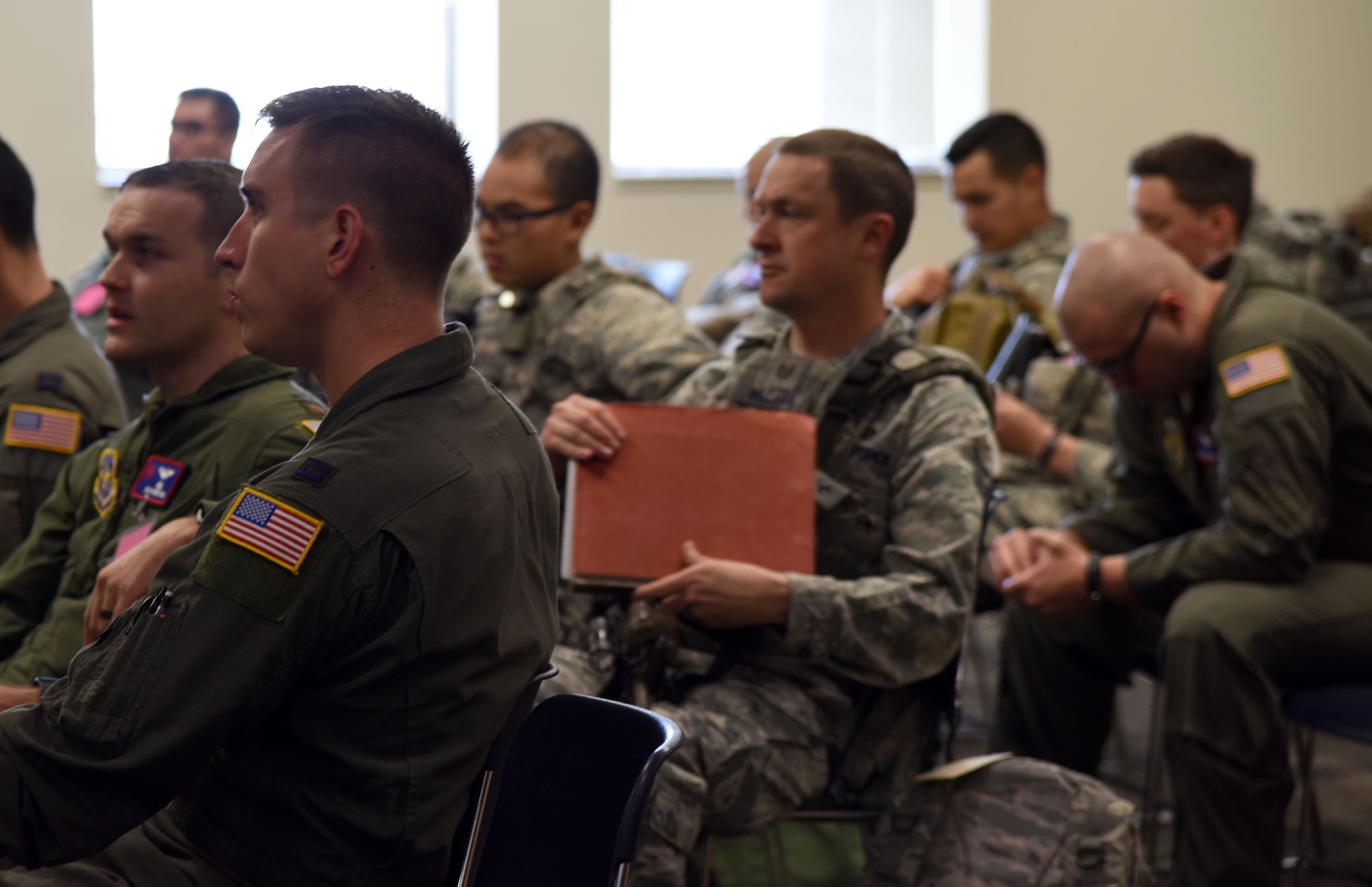 Airmen listen to a briefing during Global Thunder 19, Oct. 31, 2018, at McConnell Air Force Base, Kan. Global Thunder is a globally integrated exercise that provides training opportunities that assess all U.S. Strategic Command (USSTRATCOM) mission areas and joint and field training operational readiness, with a specific focus on nuclear readiness. USSTRATCOM has global responsibilities assigned through the Unified Command Plan that includes strategic deterrence, nuclear operations, space operations, joint electromagnetic spectrum operations, global strike, missile defense, and analysis and targeting. (U.S. Air Force photo by Staff Sgt. Joshua Crawley)