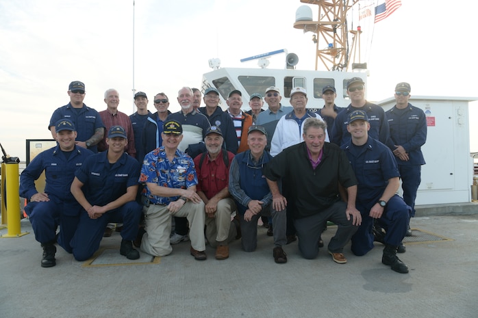 The crew of U.S. Coast Guard Cutter Cormorant and members of the U.S. Coast Guard Academy class of 1965, pose for a group photo Nov. 7, 2018, in Charleston, S.C. The ship’s crew took the class of 1965 on a tour of the Charleston Harbor during the 50-year anniversary of when they deployed to Vietnam. The class was deployed to Vietnam in 1968 where they patrolled the coast of the country during the conflict.