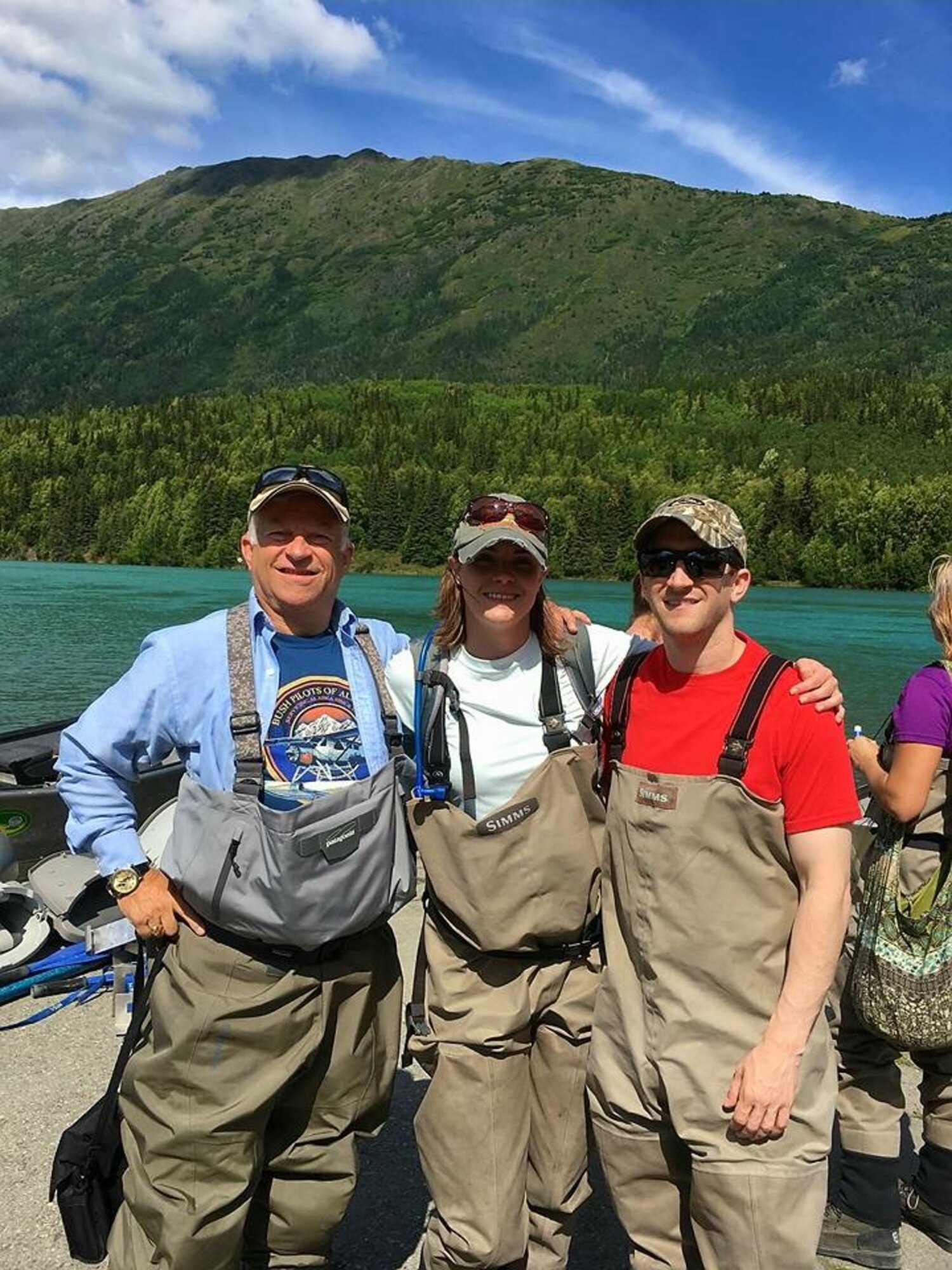 U.S. Air Force Maj. Jeremy Boudreaux, 83rd Fighter Weapons School Squadron F-22 program manager, right, with his wife Jessie, middle, and his father John, left, were fishing in Alaska while he was stationed there.  “Jeremy’s dad was full of life and loved every moment he got to spend on this earth. You could see that in the way he smiled and his eyes would sparkle at the idea of new experiences and adventure,” said Jessie Boudreaux. (Courtesy Photo)