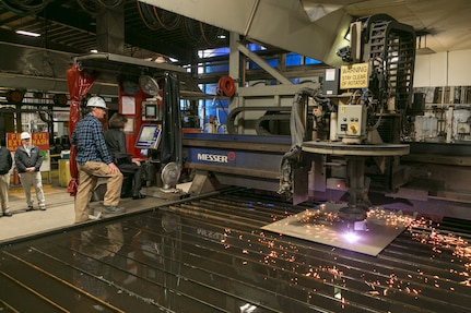 U.S. Sen. Susan M. Collins makes the initial cut of steel for the future USS Patrick Gallagher (DDG
127) at Bath Iron Works.