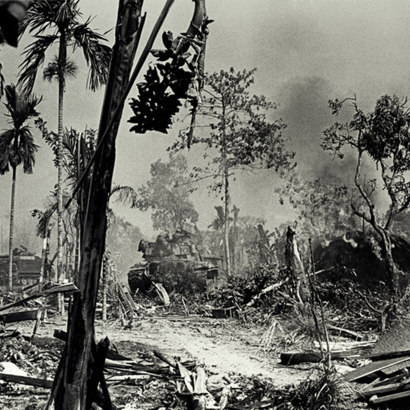 Army tanks advance against enemy positions in South Vietnam.