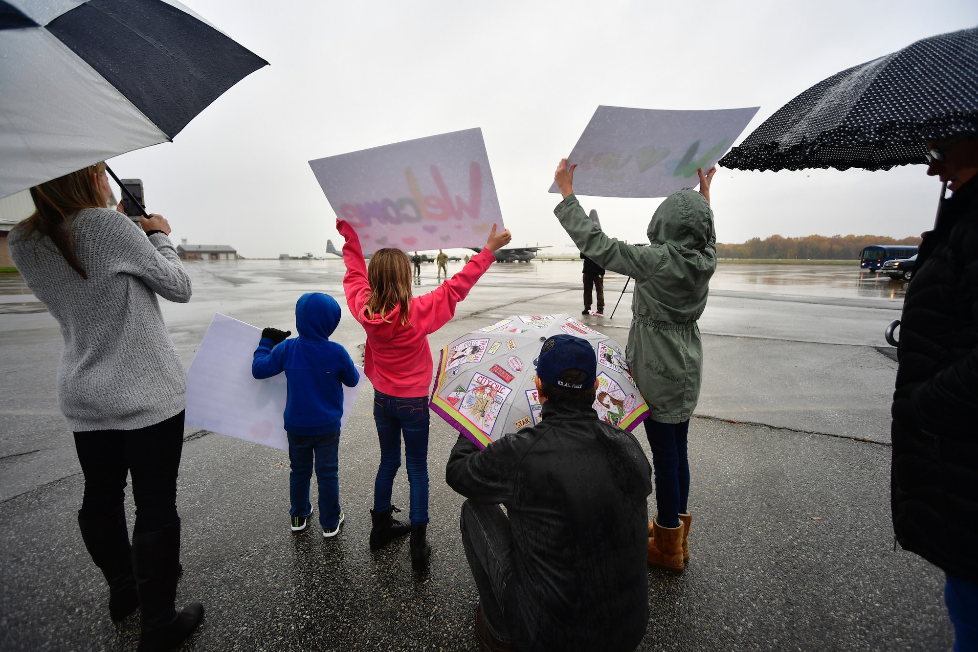 Families of Delaware Air National Guardsman watch as Airmen arrive home from deployment at New Castle Air National Guard Base, Del., Nov. 9, 2018. Over seventy percent of the Delaware ANG are part-time, traditional Guardsmen and deployed for their first time. (U.S. Air National Guard photo by Staff Sgt. John Michaels)