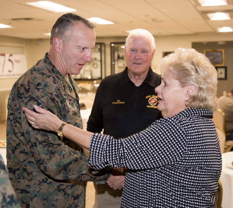 Lietenant General Charels G. Chiarotti, Deputy Commandant/Installations and Logistics, Headquarters Marine Corps, meets with Tim and Kathy Hille, of the High Desert Marines, during an evening social at the Major General James. L. Day Conference Center aboard MCLB Barstow Nov. 6.