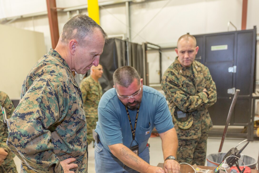 Lieutenant General Charles G. Chiarotti, Deputy Commandant/Installation and Logistics watches as Billy Stacy, nondestructive testing technician, demonstrates various parameters of testing equipment aboard Marine Corps Logistics Base Barstow, California, Nov. 6.
(U.S. Marine Corps Photo by Jack J Adamyk)