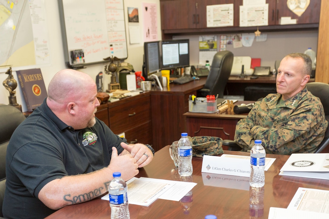 Lieutenant General Charles G. Chiarotti, Deputy Commandant/Installation and Logistics, Headquarters Marines Corps, speaks with Chad Hildebrandt, Rail Operations Superintendent, aboard Marine Corps Logistics Base Barstow, Calif., Nov. 6. (U.S. Marine Corps Photo by Jack J Adamyk)