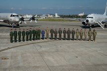 U.S. Navy Adm. Phil Davidson, commander of U.S. Indo-Pacific Command, and Joint Japan Staff Adm. Katsutoshi Kawano, Chief of Staff, pose for a photo with aircrews at Kadena Air Base Nov. 7, 2018.