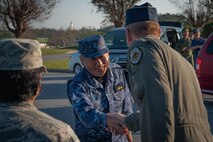 Joint Japan Staff Adm. Katsutoshi Kawano, Chief of Staff, shakes hands with Brig. Gen. Case Cunningham, 18th Wing commander, during a visit to Kadena Air Base Nov. 7, 2018