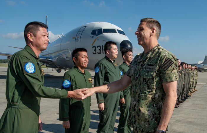 U.S. Navy Adm. Phil Davidson, commander of U.S. Indo-Pacific Command, greets aircrews at Kadena Air Base Nov. 7, 2018.