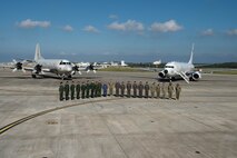 U.S. Navy Adm. Phil Davidson, commander of U.S. Indo-Pacific Command, and Joint Japan Staff Adm. Katsutoshi Kawano, Chief of Staff, pose for a photo with aircrews at Kadena Air Base Nov. 7, 2018.