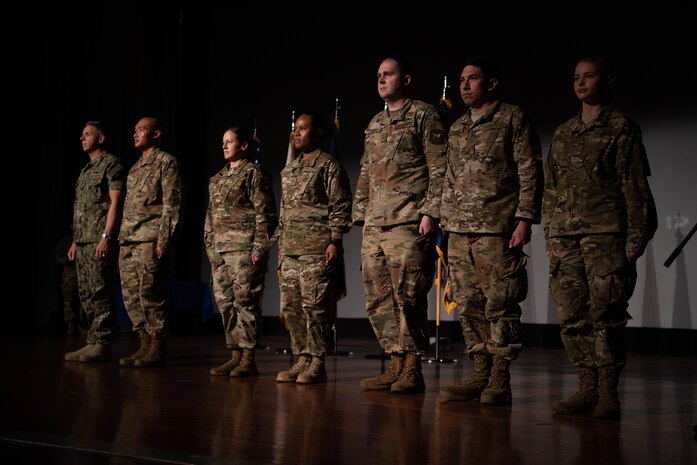 U.S. Navy Adm. Phil Davidson, commander of U.S. Indo-Pacific Commad, presents awards to members of the 353rd Special Operations Group who directly assisted in the recent rescue of a Thai children's soccer team, at Kadena Air Base Nov. 9, 2018.