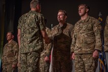U.S. Navy Adm. Phil Davidson, commander of U.S. Indo-Pacific Commad, presents awards to members of the 353rd Special Operations Group who directly assisted in the recent rescue of a Thai children's soccer team, at Kadena Air Base Nov. 9, 2018.