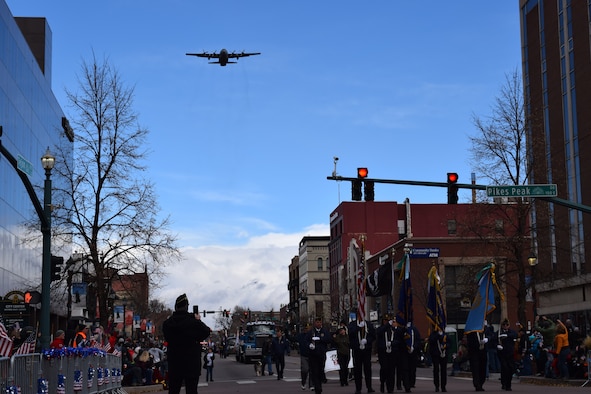 A C-130 Hercules aircraft assigned to the Air Force Reserve Command’s 302nd Airlift Wing, Peterson Air Force Base, Colorado, performs a flyover during the Colorado Springs Veterans Day parade downtown Nov. 3, 2018.  This year’s parade, themed “Celebrating 100 Years of Armistice/Veterans Day 1918-2018,” included approximately 4,000 parade participants from more than 90 organizations and was attended by an estimated 40,000 spectators.  (U.S. Air Force photo by Ann Skarban)