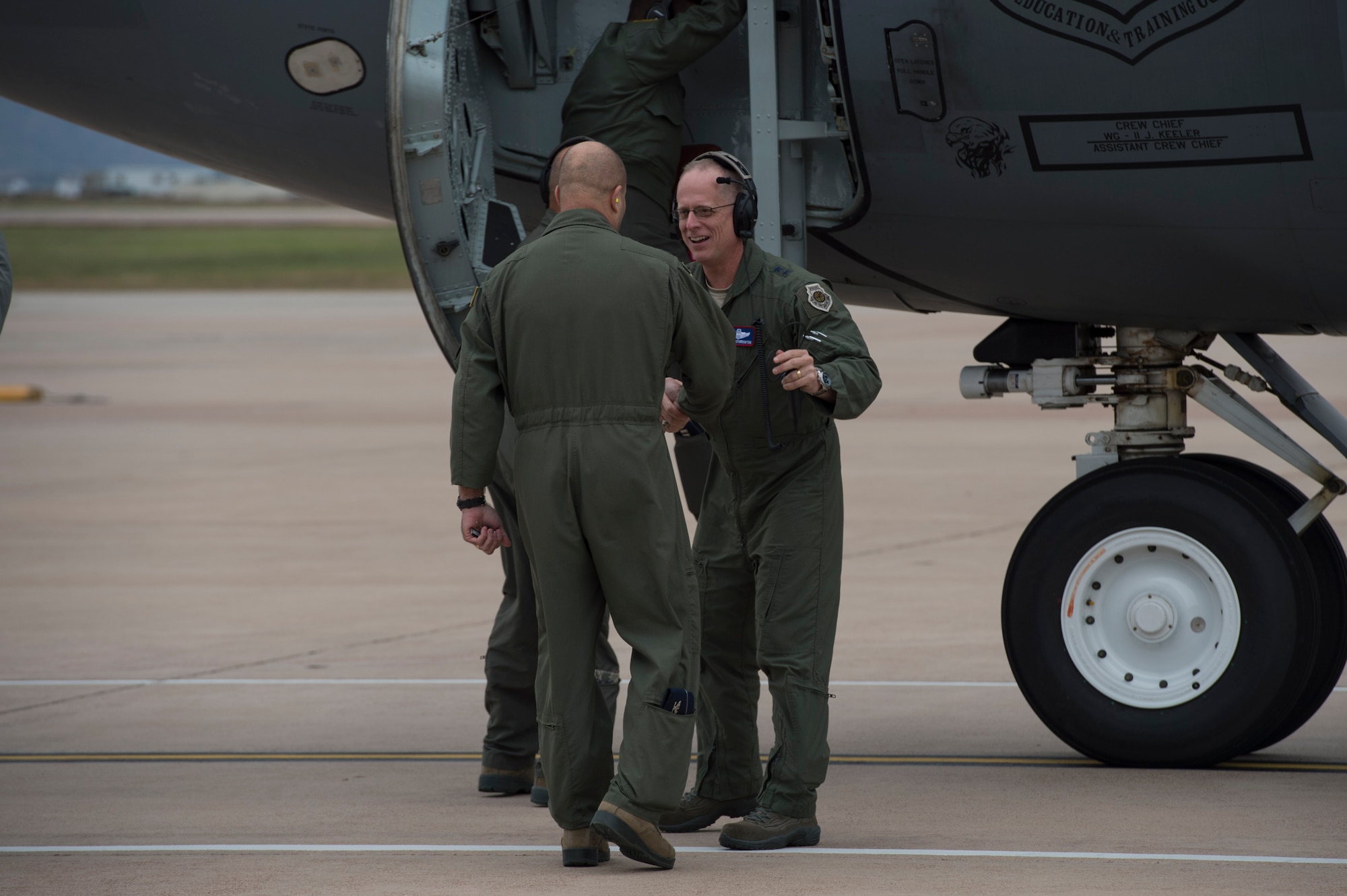 U.S. Air Force Col. Eric Carney, 97th Air Mobility Wing commander, greets U.S. Air Force Maj. Gen. Mark Weatherington, Air Education and Training Command deputy commander, Nov. 8, 2018, at Altus Air Force Base, Okla. Weatherington spent two days seeing the mission of the men and women of the Mighty 97th. (U.S. Air Force photo by Senior Airman Cody Dowell)