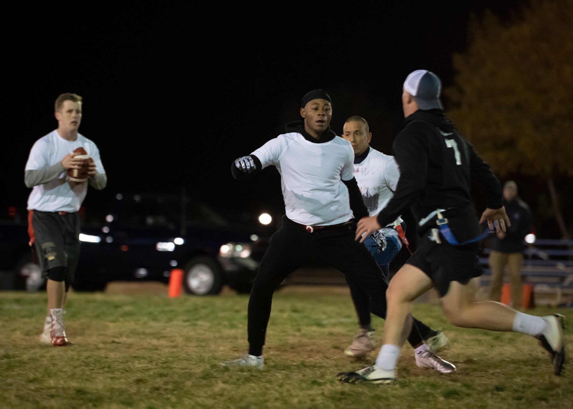 Airman 1st Class Joshua Robertson, SF Sykes lineman, blocks rushers from SF Stankiewicz during the 2018 intramural flag football championship at Kirtland Air Force Base, N.M., Nov. 8. (U.S. Air Force photo by Staff Sgt. J.D. Strong II)