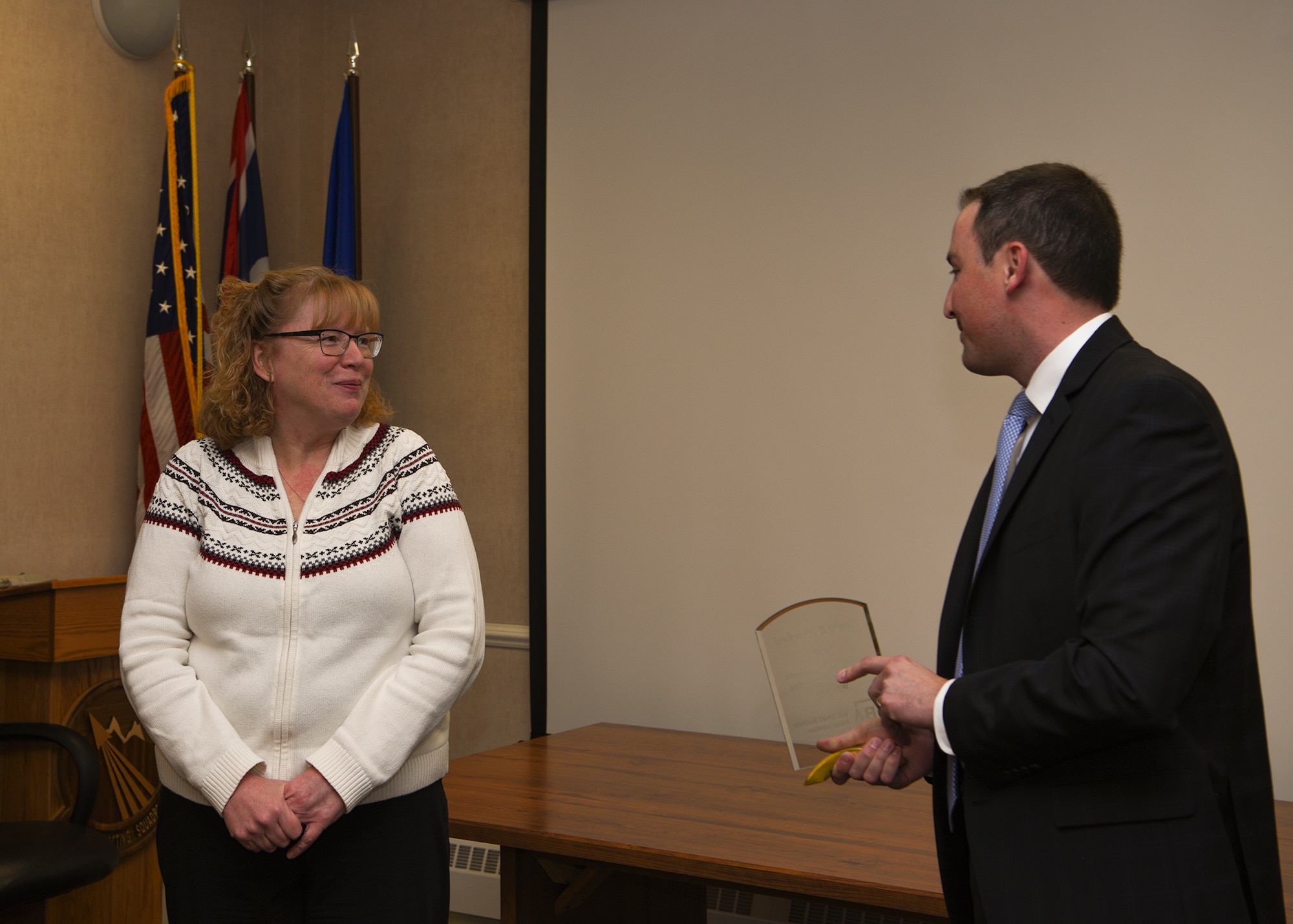 Award winner Sandra Rutherford, 90th Contracting Squadron director of business operations, is presented the Small Business Advocate of the Year award for the State of Wyoming, by Dan Nordberg, U.S. Small Business Administration Region VIII administrator Nov. 7, 2018, at F.E. Warren Air Force Base, Wyo. The award recognizes individuals who have provided exceptional services to small businesses. Rutherford sought out opportunities and ensured openings were offered to women and veteran owned firms and small businesses. (U.S. Air Force photo by Senior Airman Ashley N. Sokolov)