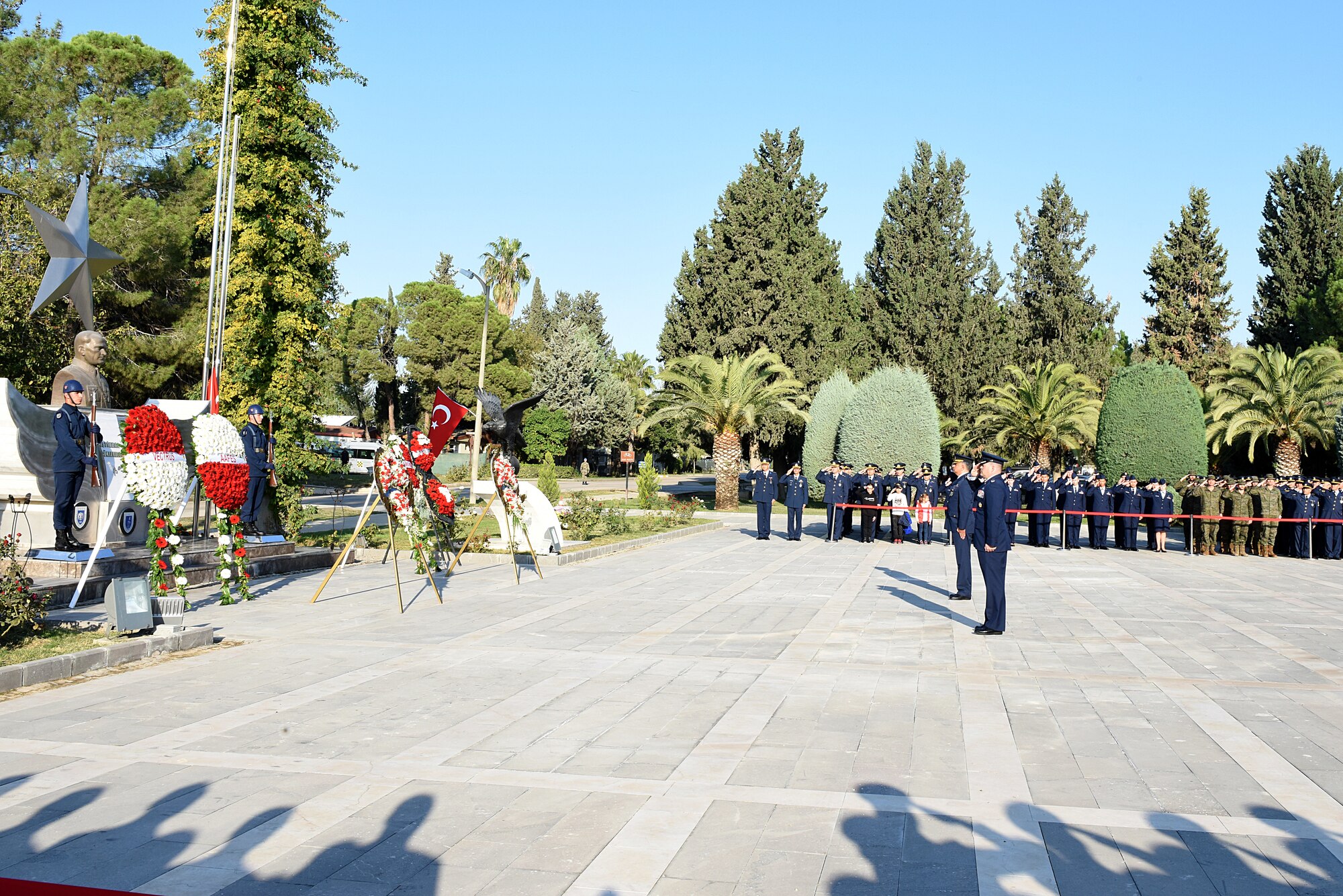 U.S. Air Force, Turkish Air Force and Spanish Army service members salute a memorial of Ataturk during Ataturk Memorial Day ceremony at Incirlik, Turkey.