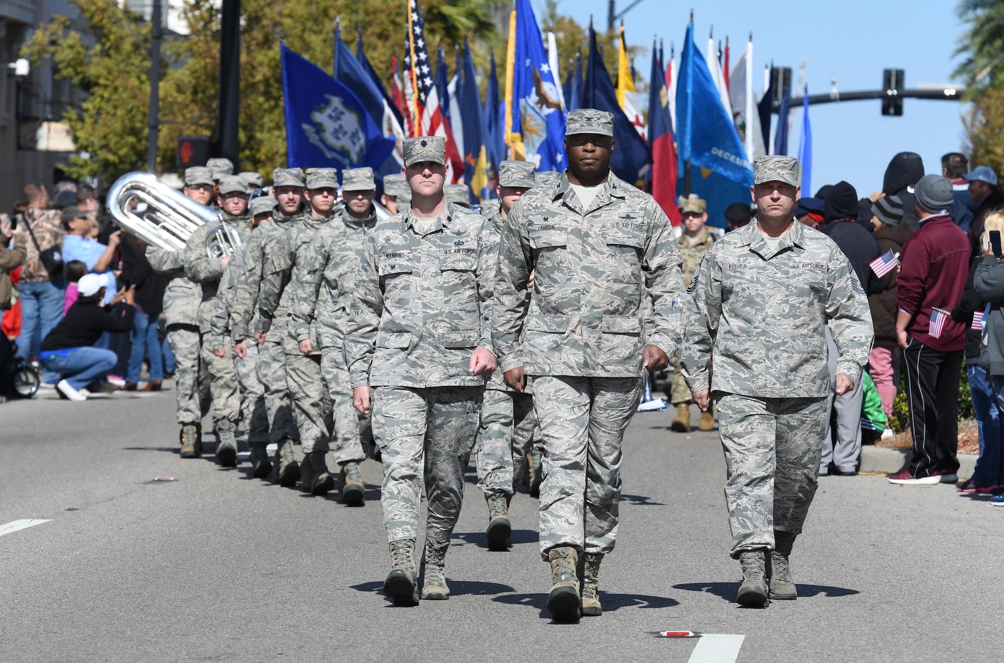 U.S. Air Force Lt. Col. Michael Manning, 81st Training Group deputy commander, Col. Leo Lawson Jr., 81st TRG commander, and Chief Master Sgt. Anthony Fisher, 81st TRG superintendent, march in the 18th Annual Gulf Coast Veterans Day Parade in Gulfport, Mississippi, Nov. 10, 2018. Keesler Air Force Base leadership along with hundreds of Airmen attended and participated in the parade in support of all veterans past and present. More than 70 unique floats, marching bands and military units marched in the largest Veterans Day parade on the Gulf Coast. (U.S. Air Force photo by Kemberly Groue)
