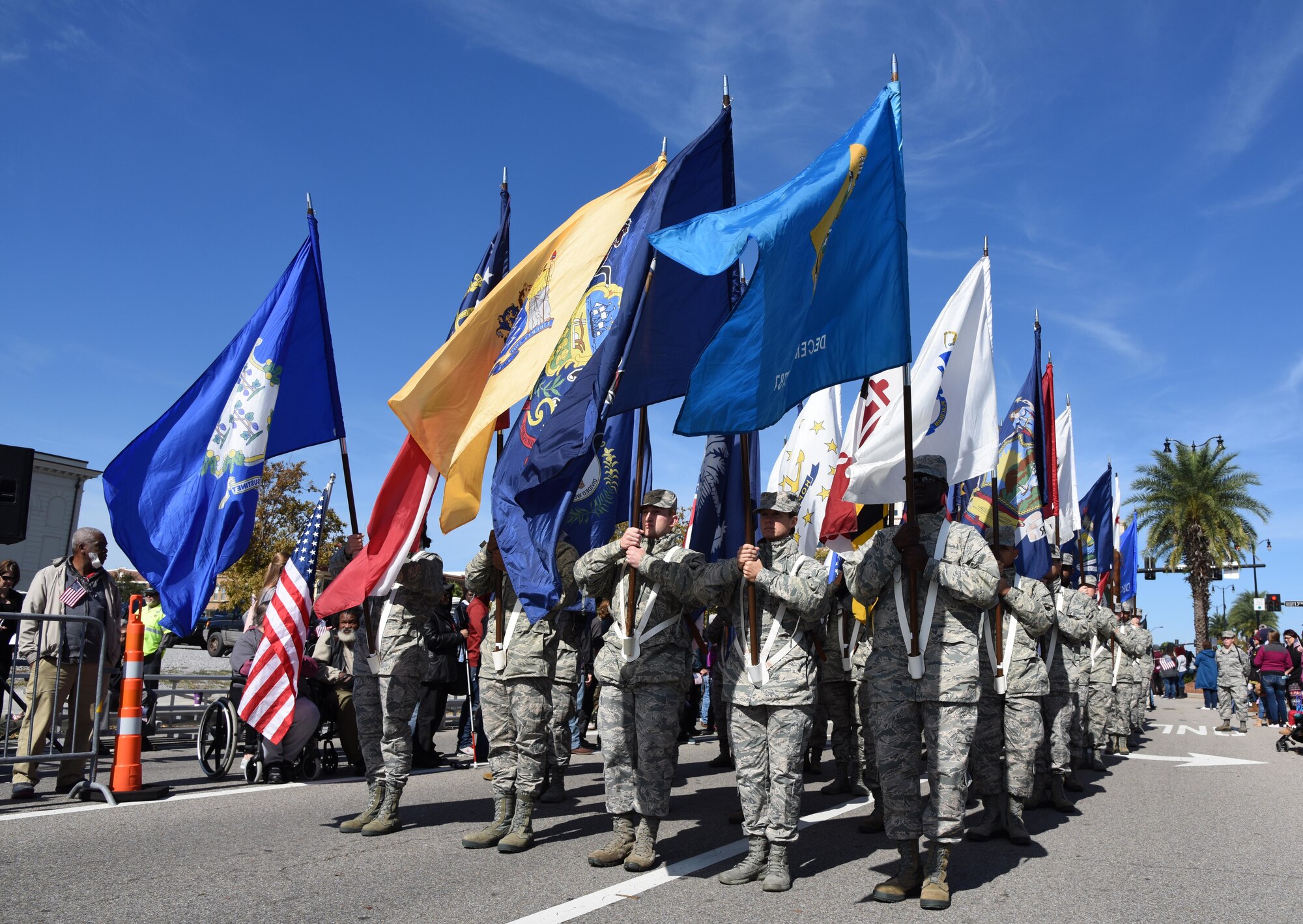 Airmen from the 81st Training Group carrying the 50 state flags march in the 18th Annual Gulf Coast Veterans Day Parade in Gulfport, Mississippi, Nov. 10, 2018. Keesler Air Force Base leadership along with hundreds of Airmen attended and participated in the parade in support of all veterans past and present. More than 70 unique floats, marching bands and military units marched in the largest Veterans Day parade on the Gulf Coast. (U.S. Air Force photo by Kemberly Groue)