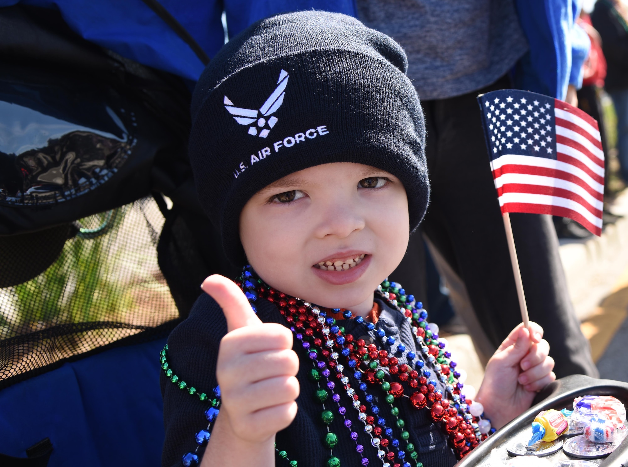 Connor Bentley, son of U.S. Air Force Airman Brandon Bentley, 335th Training Squadron student, attends the 18th Annual Gulf Coast Veterans Day Parade in Gulfport, Mississippi, Nov. 10, 2018. Keesler Air Force Base leadership along with hundreds of Airmen attended and participated in the parade in support of all veterans past and present. More than 70 unique floats, marching bands and military units marched in the largest Veterans Day parade on the Gulf Coast. (U.S. Air Force photo by Kemberly Groue)