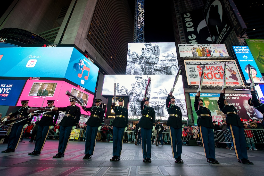 The U.S. Army drill team performs rifle drills at an exhibition in Times Square in New York.