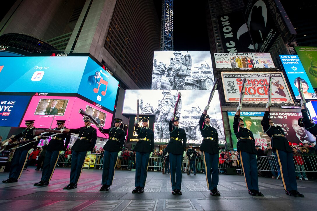 The U.S. Army drill team performs rifle drills at an exhibition in Times Square in New York.