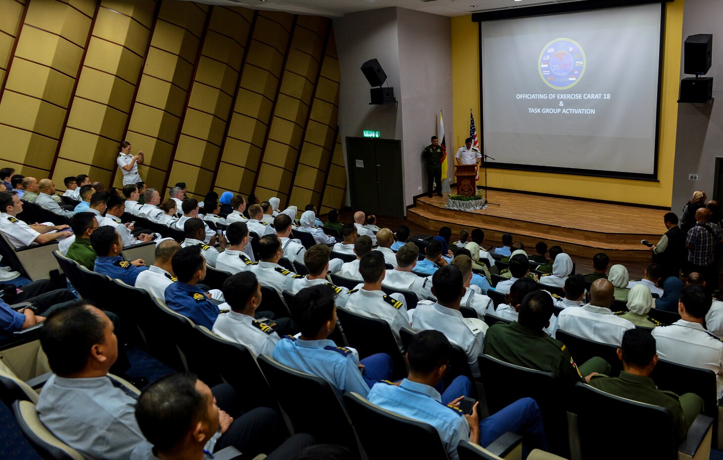 Muara Naval Base, Brunei (Nov. 12, 2018) - Capt. Yusuf Masron, Royal Brunei Navy Acting Joint Force Commander, speaks to exercise participants and media during the opening ceremony for Cooperation Afloat Readiness and Training (CARAT) Brunei 2018. CARAT Brunei 2018 marks the 24th iteration of the maritime exercise series and reflects the growing relationship between the U.S. and Royal Brunei Navy to further expand bilateral and multilateral exercises in cooperatively ensuring maritime security, stability and prosperity.