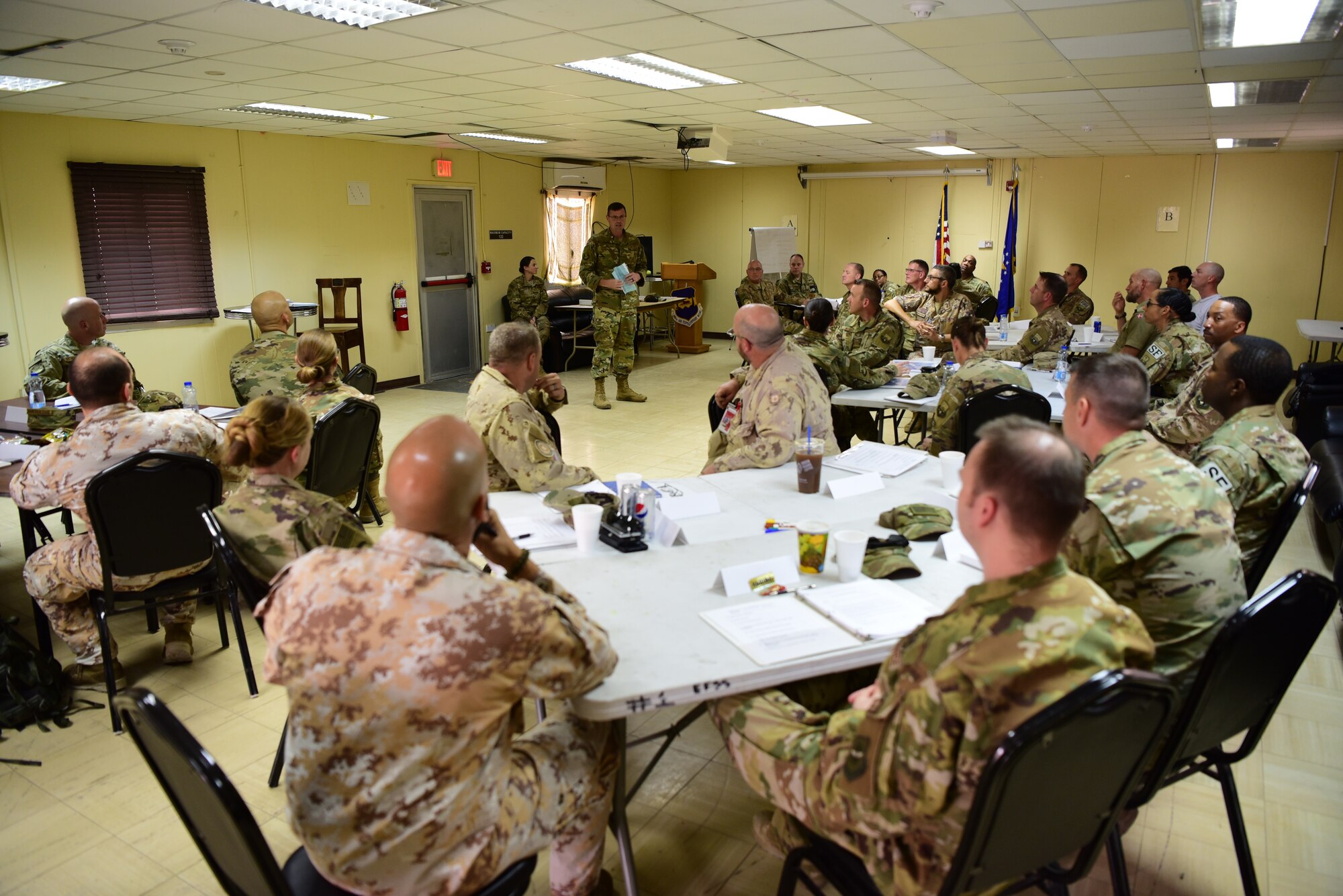 Chief Master Sgt. Chad Welch, 386th Air Expeditionary Wing command chief, speaks to students of the senior non-commissioned officer leadership course Nov. 2, 2018, at an undisclosed location in Southwest Asia. This marked the first time the SNCOLC was hosted in a deployed environment, and the first time it has ever been offered to coalition partners. (U.S. Air Force photo by Staff Sgt. Christopher Stoltz)