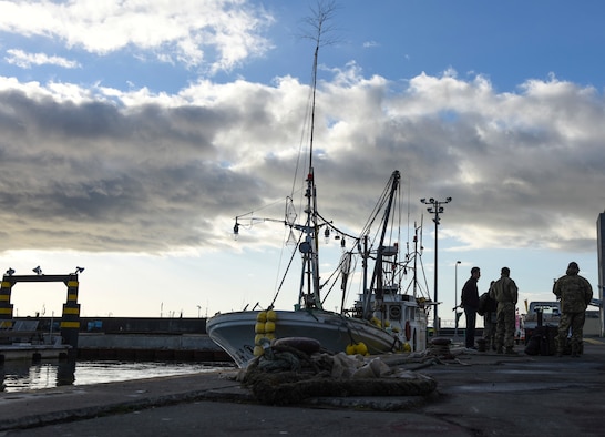 U.S. Air Force Airmen with the 31st Rescue Squadron prepare to board a Misawa City fishing boat for a combat search and rescue training mission during exercise Keen Sword 19, near Misawa Air Base, Japan, Oct. 31, 2018. Members readied themselves on an early morning, ensuring they prepared to execute a CSAR mission at a moment’s notice. Not only did the 31st RQS personnel practice recovering thousands of dollars worth of equipment, but completed their mission to safely locate, recover and evacuate a simulated downed pilot. (U.S. Air Force photo by Senior Airman Sadie Colbert)