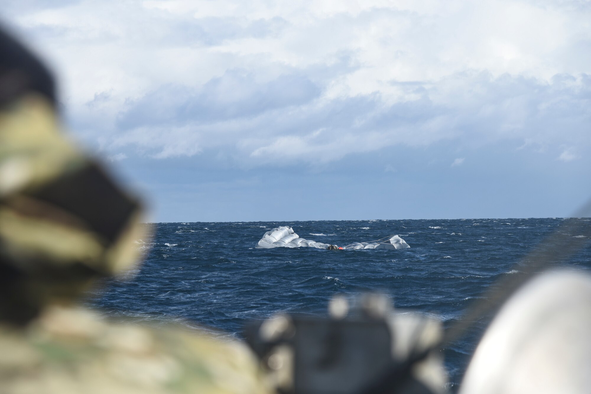 A U.S. Air Force pararescue specialist makes his way toward a Misawa City fishing boat for a combat search and rescue training operation during exercise Keen Sword 19, near Misawa Air Base, Japan, Oct. 31, 2018. The training ensured members of the 31st Rescue Squadron with Kadena Air Base, Japan, could tactfully locate and rescue a downed pilot in a simulated combat area. The U.S.-Japan mutual security treaty is a symbol of the U.S. commitment to Japan and the region and allows the United States to provide forward-deployed forces that can rapidly respond to counter aggression against Japan and other regional allies and partners. (U.S. Air Force photo by Senior Airman Sadie Colbert)