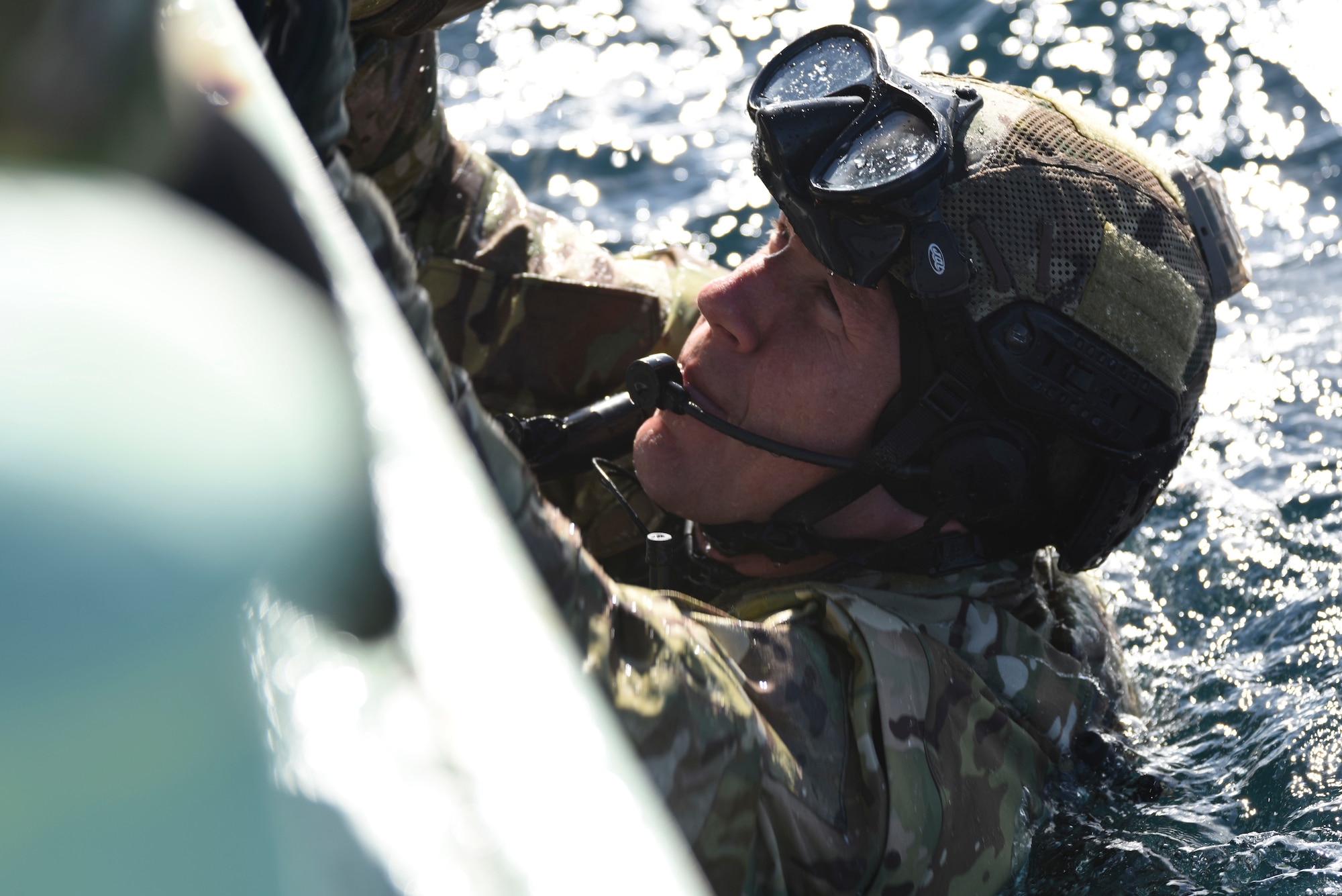 U.S. Air Force Capt. John Krzyminski, a 31st Rescue Squadron combat rescue officer from Kadena Air Base, Japan, grabs a helping hand from a team member for a combat search and rescue training mission during exercise Keen Sword 19, near Misawa Air Base, Japan, Oct. 31, 2019. Keen Sword is the ideal training scenario, allowing Japan Self-Defense Force and U.S. military forces to work together across a variety of areas and enhances the interoperability of U.S. and Japan forces. Exercises like Keen Sword demonstrate the United States’ and Japan’s strong commitment to a free and open Indo-Pacific region. (U.S. Air Force photo by Senior Airman Sadie Colbert)