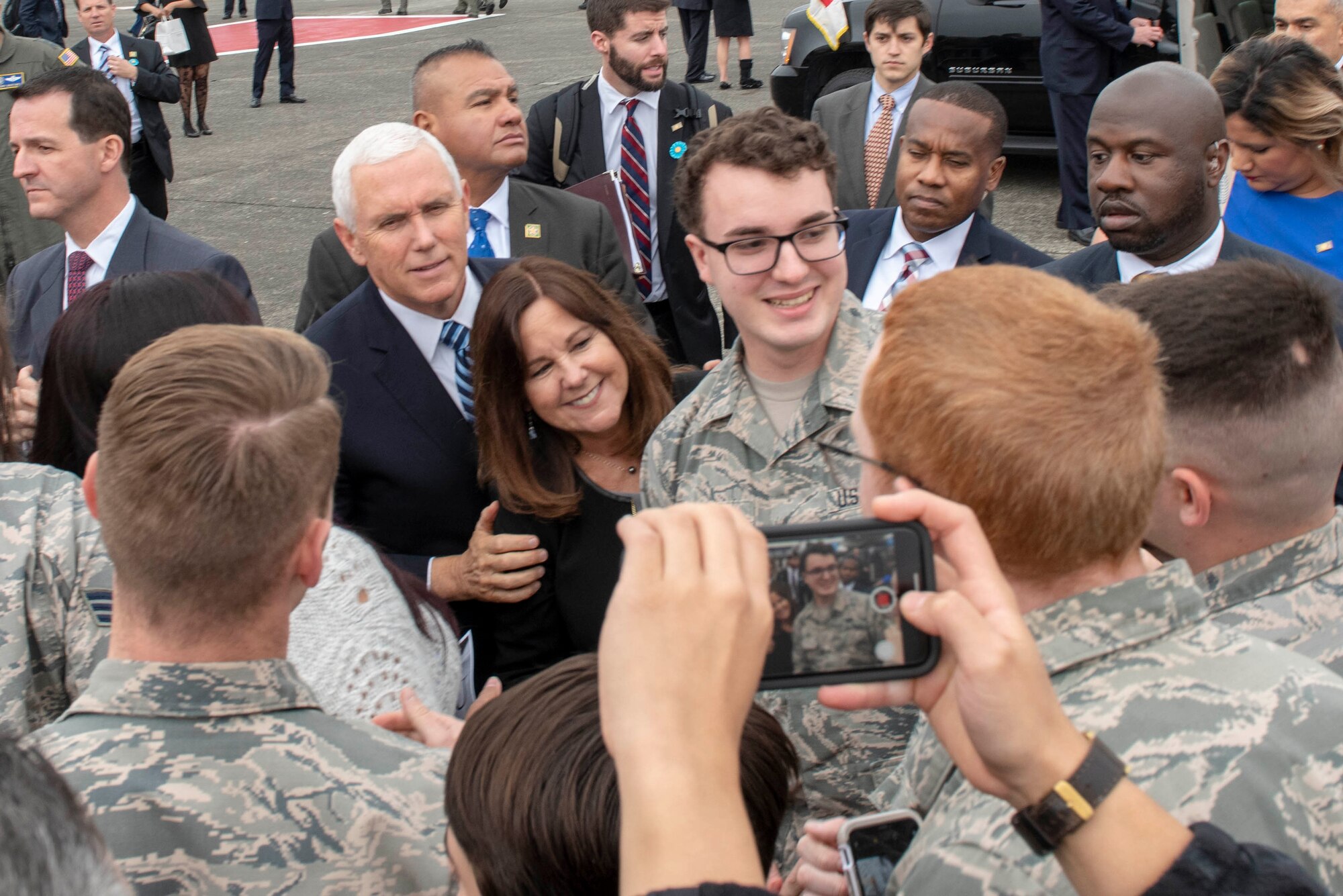 Vice President of the United States Michael R. Pence and his wife, Second Lady Karen Pence, pose for a photo with service members and their families at Yokota Air Base, Japan, Nov. 13, 2018.