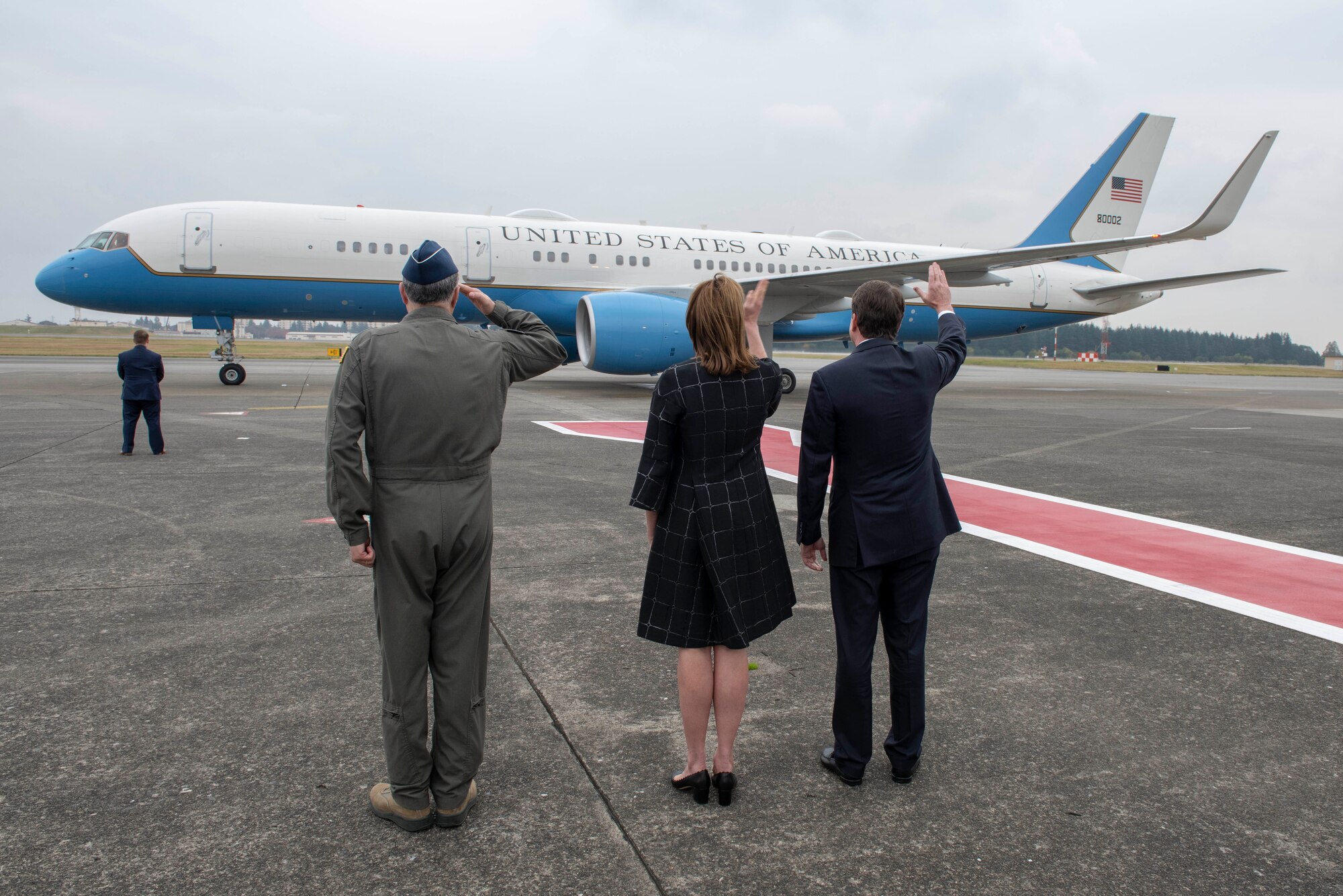 Lt. Gen. Jerry P. Martinez, U.S. Forces Japan and 5th Air Force commander, William F. Hagerty, U.S. Ambassador to Japan, and his wife Chrissy Hagerty, wave goodbye to Air Force Two as it departs Yokota Air Base, Japan, Nov. 13, 2018