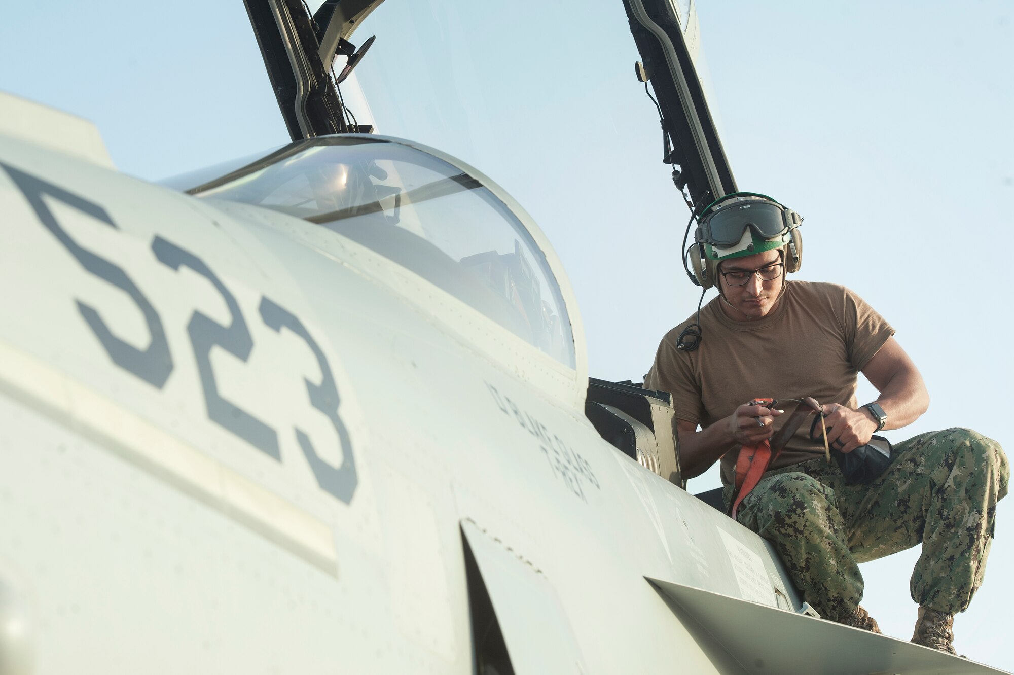 Aviation Machinist Mate 3rd Class Erik Perales from the Electronic Attack Squadron 135 (VAQ-135) “Black Ravens” conducts maintenance on an EA-18G Growler, Oct. 30, 2018, at Al Udeid Air Base, Qatar. The electronic warfare aircraft has electronic attack, jamming, and satellite communication capabilities as well as communication countermeasures. VAQ-135 will replace VMAQ-2, which operated EA-6B Prowlers. VAQ-135 is deployed to the U.S. 5th Fleet area of operations in support of naval operations to ensure maritime stability and security in the Central Region, connecting the Mediterranean and the Pacific through the western Indian Ocean and three strategic choke points. (U.S. Air Force photo by Tech. Sgt. Christopher Hubenthal)