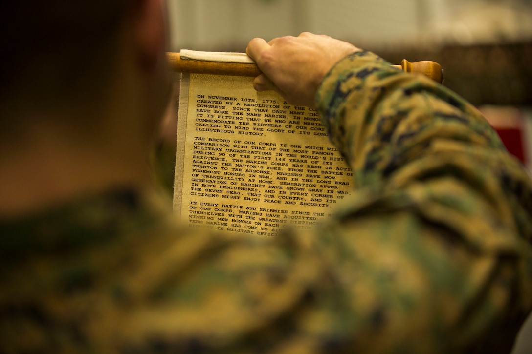 U.S. Marine Corps 2nd Lt. Connor Williams with II Marine Expeditionary Force Information Group reads Gen. John A. Lejeune’s birthday message during a cake cutting ceremony celebrating the Marine Corps’ 243rd birthday on Vaernes Air Station, Norway, Nov. 10, 2018. The ceremony is held at the conclusion of Exercise Trident Juncture 18, an exercise in place to enhance the U.S. and NATO Allies’ and partners’ abilities to work together collectively to conduct military operations under challenging conditions.