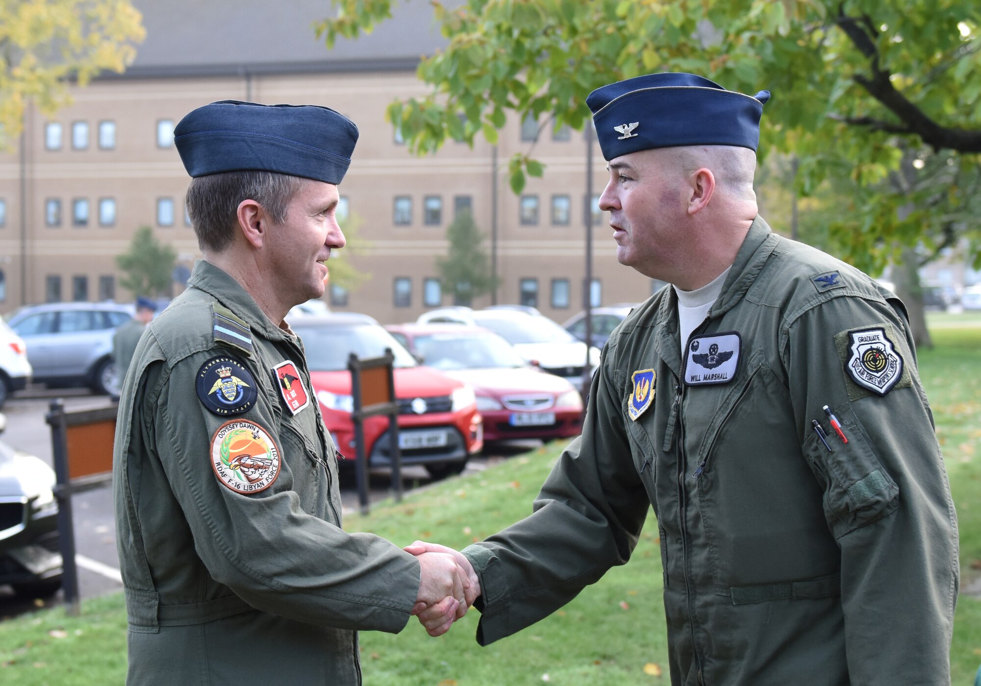 U.S. Air Force Col. William Marshall, 48th Fighter Wing commander (right), greets Royal Danish Air Force  Chief of Air Staff Maj. Gen. Anders Rex at Royal Air Force Lakenheath, England, Nov. 5, 2018.  The NATO ally visited the base to observe support to live mission operations and discuss 4th and 5th generation aircraft interoperability. (U.S. Air Force photo by Staff Sgt. Alex Echols)