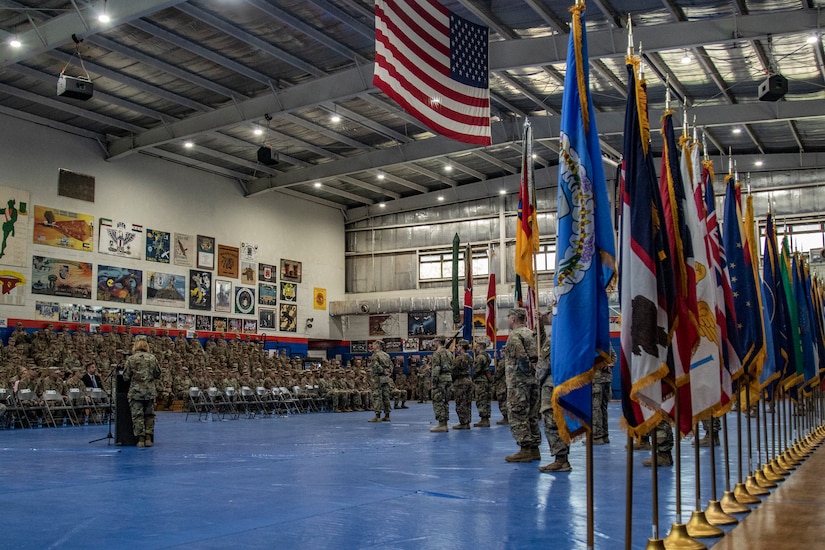 Maj. Gen. Benjamin Corell, 34th Red Bull Infantry Division commanding general and Command Sgt. Maj. Joseph Hjelmstad uncase the Division colors during a transfer of authority ceremony Nov. 12, 2018. The Minnesota National Guard unit's headquarters and headquarters battalion assumed responsibility for the Task Force Spartan mission to from the Pennsylvania National Guard's 28th Infantry Division. The 34th's HHBN is serving as a division headquarters for roughly 10,000 Soldiers conducting theater security operations in the Middle East.