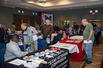 Retirees and their spouses learn about services available to them during a Retiree Appreciation Day event Nov. 3, 2018, at Joint Base San Antonio-Randolph, Texas. The event allowed military retirees and their spouses to get in touch with resources available to them and reinforced the partnership between JBSA and the retiree community. (U.S. Air Force photo by Senior Airman Stormy Archer)