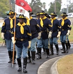 Members of the Bexar County Buffalo Soldiers march into the San Antonio National Cemetery Nov. 11 for the annual Bexar County Buffalo Soldiers Commemorative Ceremony. Comprised of former slaves, freed men and Black Civil War veterans, the historic Buffalo Soldiers persevered through the most difficult conditions imaginable to become some of the most elite and most decorated units in the U.S. Army.